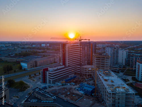 Riga, Latvia. July 20, 2018. Aerial sunset view over Riga near Jauna Teika district by the VEF castle. Busy streets of Riga from above. photo