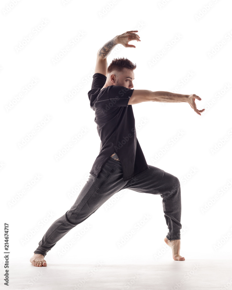 Young beautiful dancer is posing in studio Young beautiful dancer is posing in studio