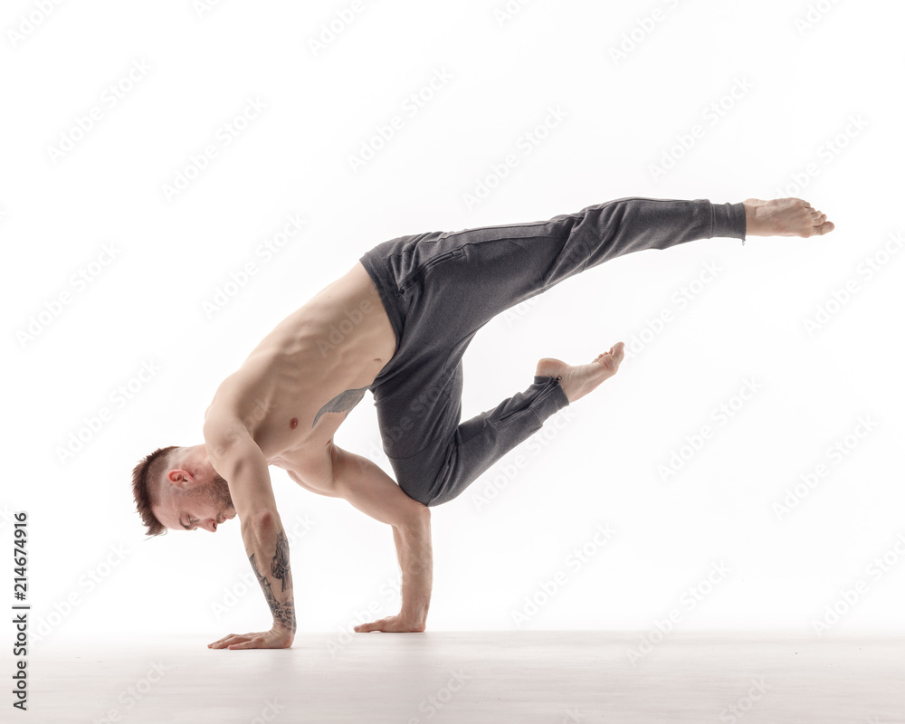 Naklejka premium Young beautiful dancer is posing in studio