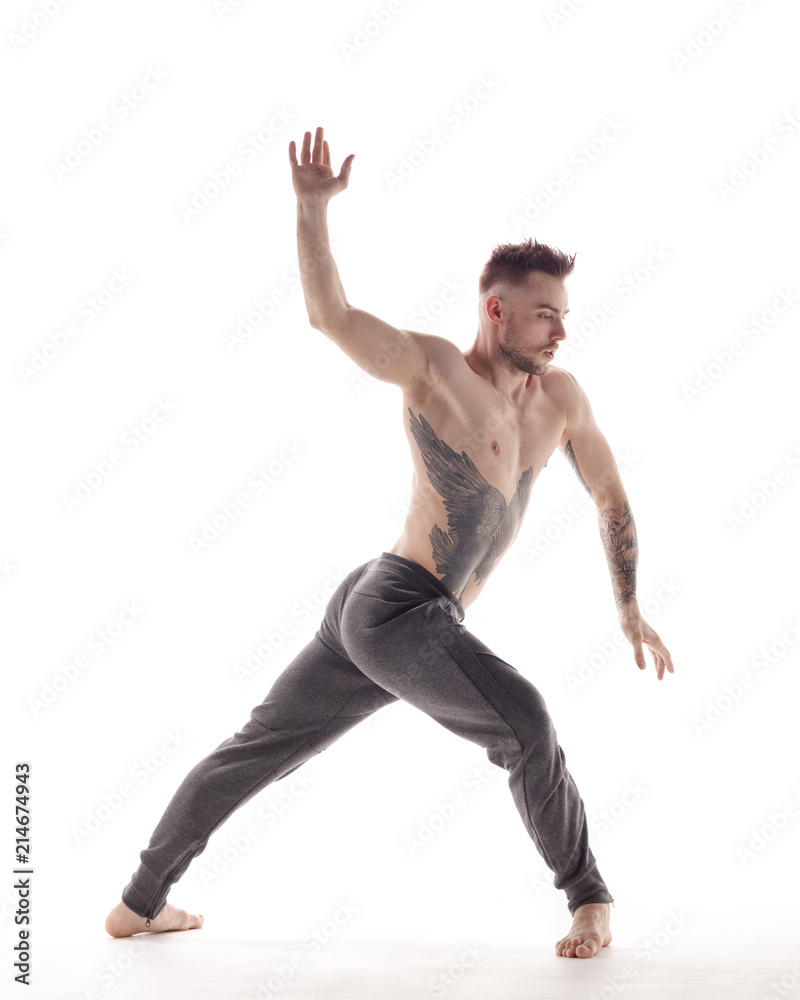 Young beautiful dancer is posing in studio Young beautiful dancer is posing in studio