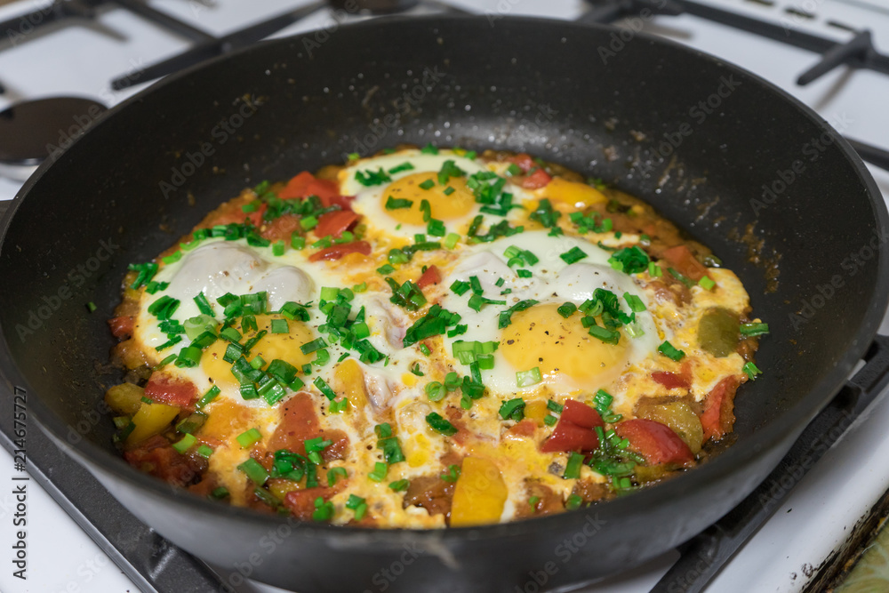 Morning Breakfast of fried eggs with vegetables and fresh herbs. Morning Breakfast of fried eggs with vegetables and fresh herbs.