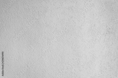 texture of the surface of the wall covered with decorative plaster of the woodworm type