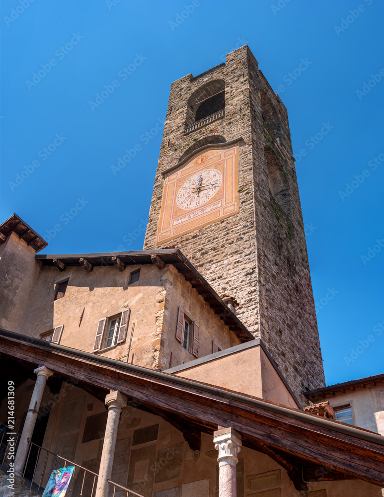 Bergamo, Italy - May 10, 2018: Bell tower, clock tower. Ancient architecture of Old town or Upper City in Bergamo. Medieval bell tower with clock in Bergamo