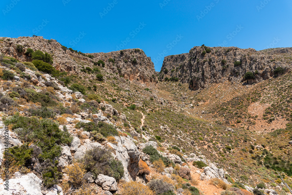 Vreiko Cave Pass Lasithi Makrigialos mountains wonderland tour, steep slopes, rocky peaks for hiking adventure recreation sports in Crete, Greece.