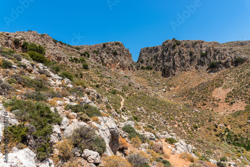 Vreiko Cave Pass Lasithi Makrigialos mountains wonderland tour, steep slopes, rocky peaks for hiking adventure recreation sports in Crete, Greece. © Stockphototrends
