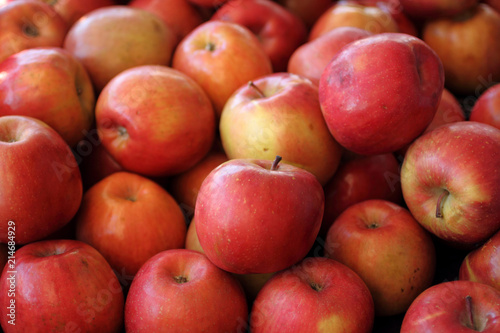Fresh Fuji apples at a farmer's market.
