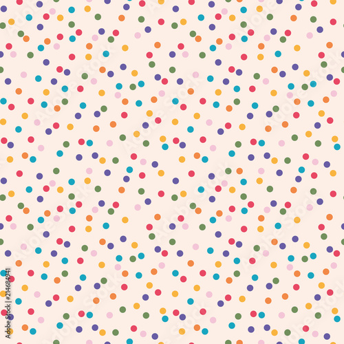 Seamless colorful wild polka dot pattern on light background. Suitable for party invitations, card design or offbeat fabrics.