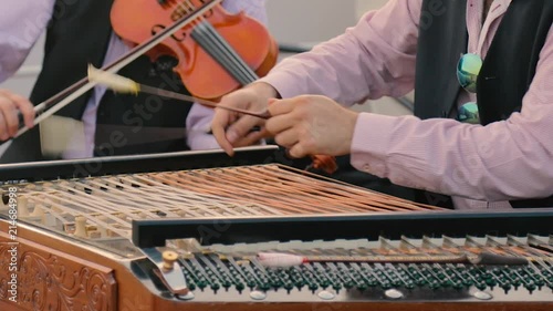 Close up of HANDS playing a CIMBALON in BUDAPEST, HUNGARY photo