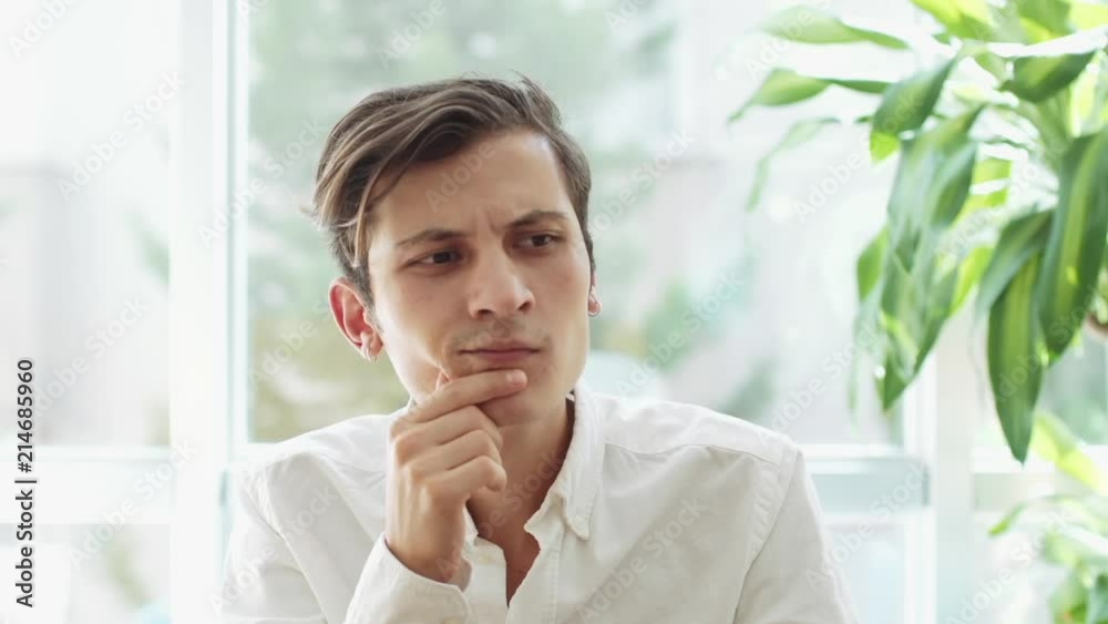 Young Man Thinking and Having Great Idea Young Man Thinking and Having Great Idea