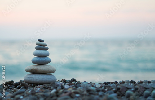 Photo made of stone tower on the beach and blur background
