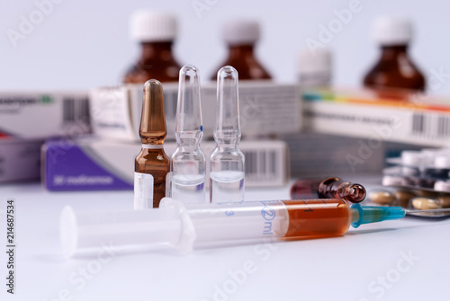 Syringes with medication, ampoules and vials, blister packs