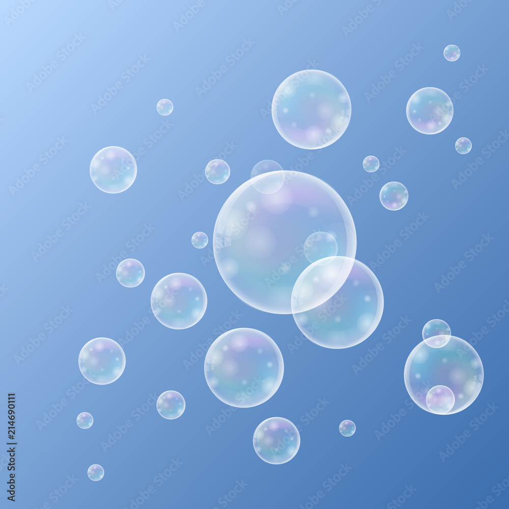 Realistic soap bubbles with rainbow reflection set isolated on the blue background.