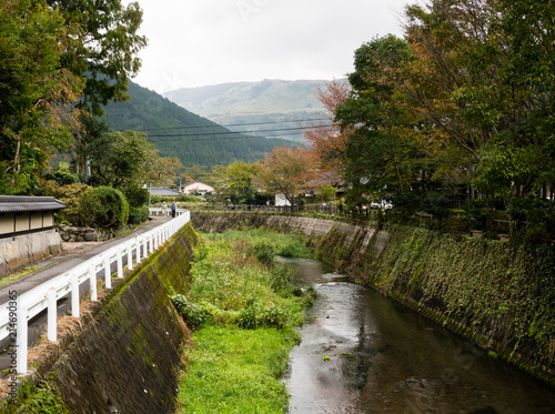 Charming riverside street in Yufuin, a famous hot spring resort in Oita prefecture, Japan