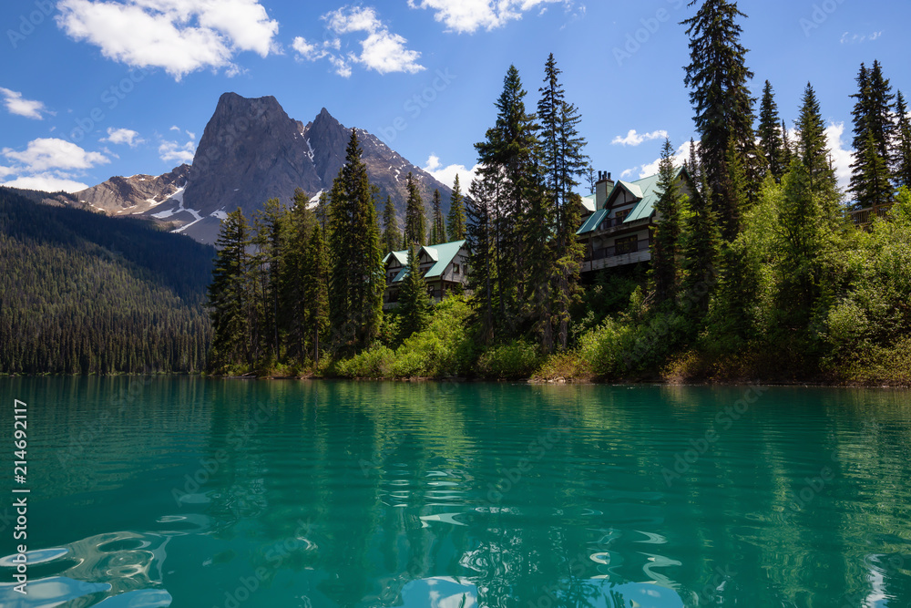 Cabins in Emerald Lake during a vibrant sunny summer day. Located in British Columbia, Canada.