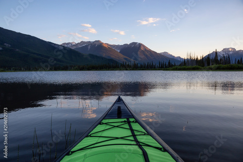 Kayaking in a beautiful lake surrounded by the Canadian Mountain Landscape. Taken in Vermilion Lakes, Banff, Alberta, Canada. © edb3_16