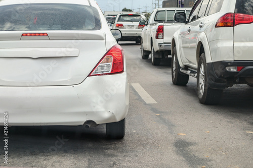 Backside of car has dented rear bumper damaged after accident on the road