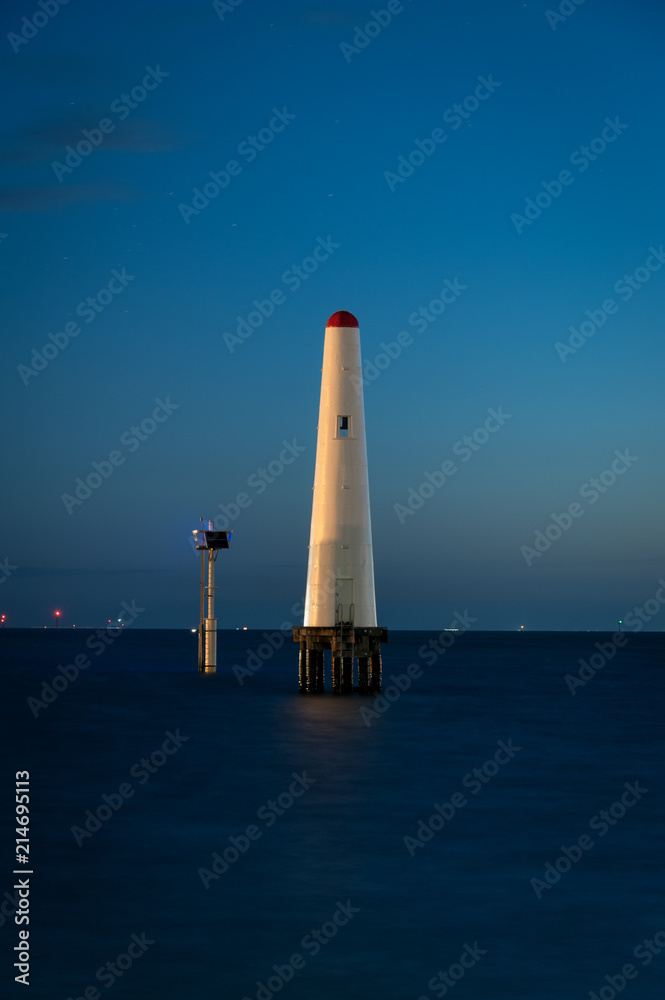 A white light beacon tower in the evening light, Port Phillip Bay, Melbourne Australia