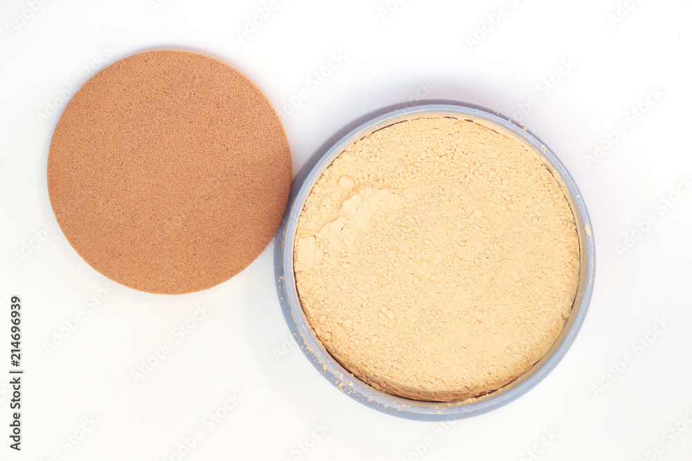 Cream beige powder and puff on white background Cream beige powder and puff on white background