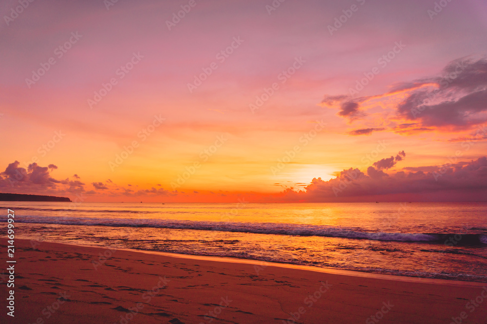 Colorful sunset or sunrise at tropical beach with ocean in Bali