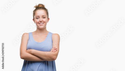 Young blonde woman happy face smiling with crossed arms looking at the camera. Positive person.