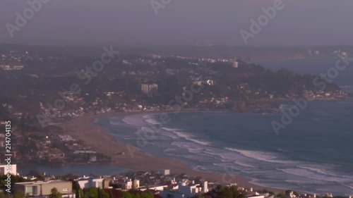 slowmotion of waves on a beach from far away photo