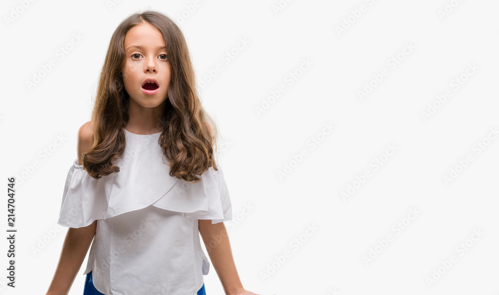 Brunette hispanic girl afraid and shocked with surprise expression, fear and excited face. Brunette hispanic girl afraid and shocked with surprise expression, fear and excited face.