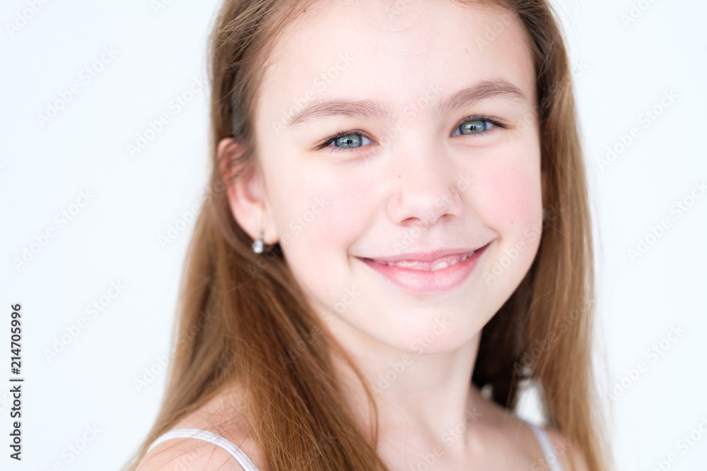 emotion face. happy delighted smiling child. little girl portrait on white background. mood feelings personality and facial expression concept emotion face. happy delighted smiling child. little girl portrait on white background. mood feelings personality and facial expression concept