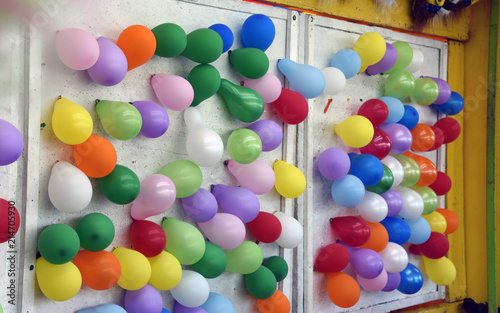 Colorful balloons on wall