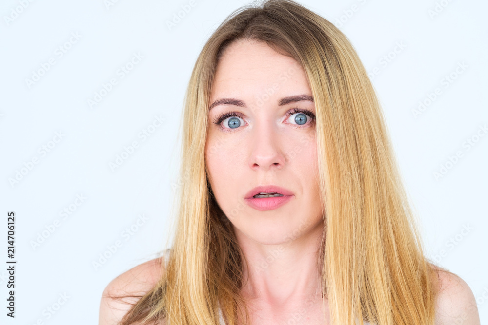 emotion face. overwhelmed perplexed shocked surprised astounded woman young beautiful blond girl portrait on white background. emotion face. overwhelmed perplexed shocked surprised astounded woman young beautiful blond girl portrait on white background.