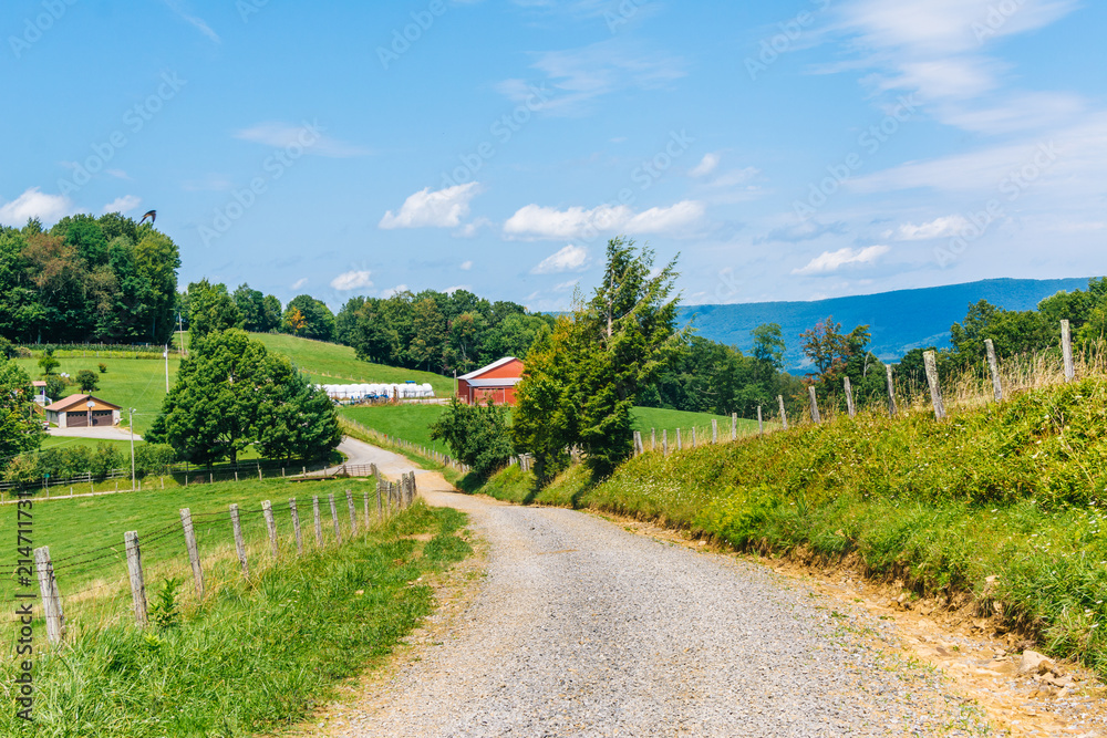 Dirt road and farms in the rural Potomac Highlands of West Virginia