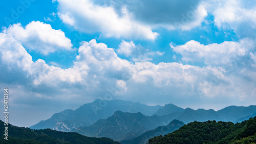 Far view of Mount Tai in summer time  with its peak was surrounded by cloud 