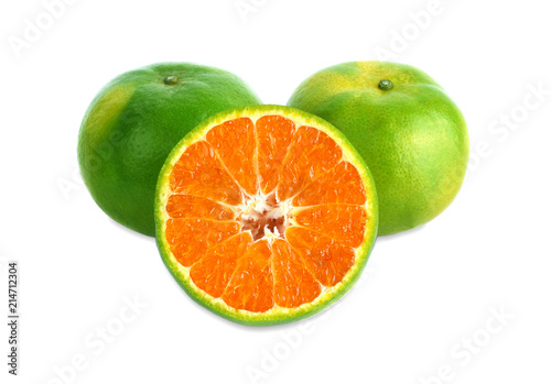 green tangerine on white background.