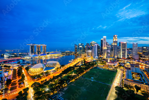 Fototapeta Naklejka Na Ścianę i Meble -  Aerial view of the Singapore landmark financial business district at twilight sunset scene with skyscraper and beautiful sky. Singapore downtown