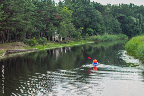 floats by canoe along the river