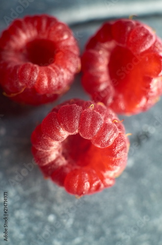 three major raspberry lie on the gray stones