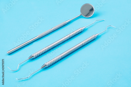 Dental tools use for dentist on the blue background.
