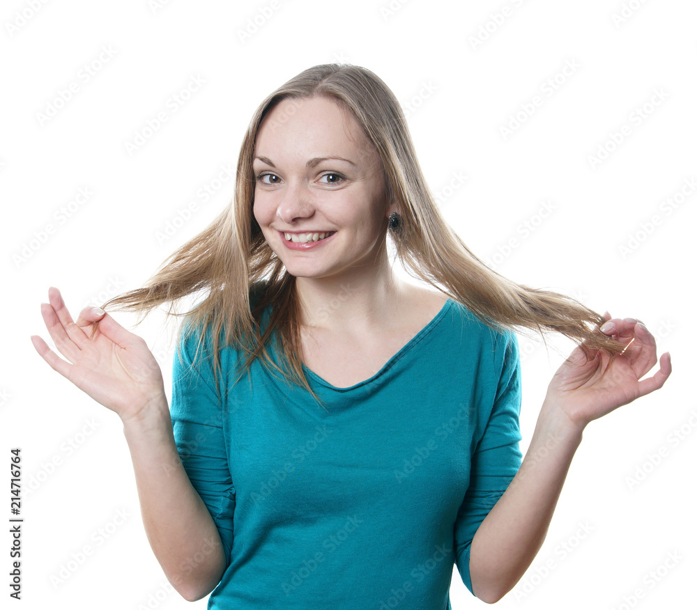 Fototapeta premium young blonde woman playing with her hair