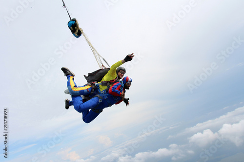 Tandem skydiving. Indian man is in the sky.