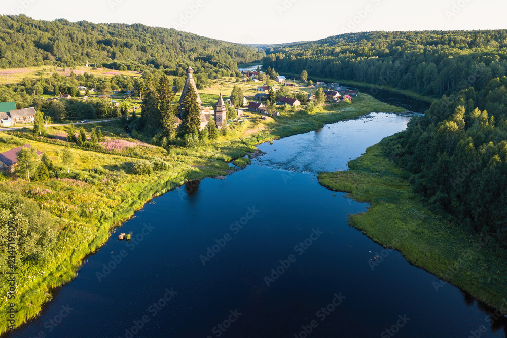 Fototapeta premium Top view of Vazhinka river in Soginicy village. Green forests of Leningrad region and Republic of Karelia, Russia.