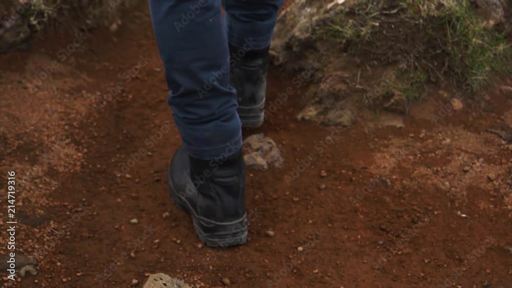 slow motion walking over red sand in heavy military boots. slow motion walking over red sand in heavy military boots.