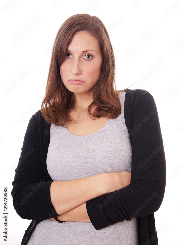 young woman sulking with crossed arms, isolated on white young woman sulking with crossed arms, isolated on white