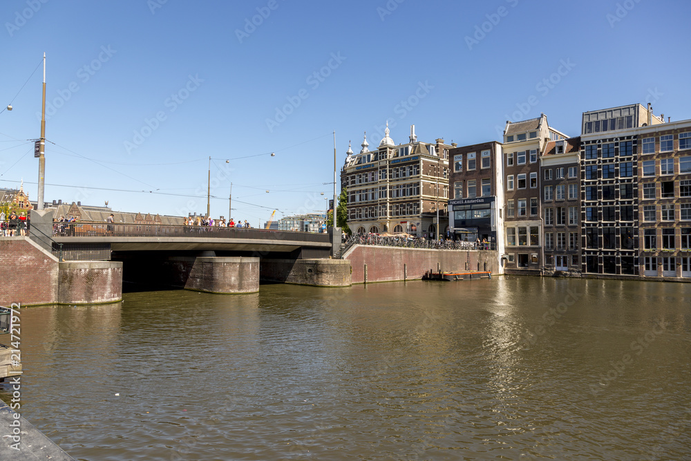 Amsterdam, Netherlands - July 02, 2018: Bridge on Damrak Street in the center of Amsterdam
