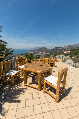 Chairs and table on the terrace overlooking the Bay of Naples and Vesuvius. Sorrento. Italy