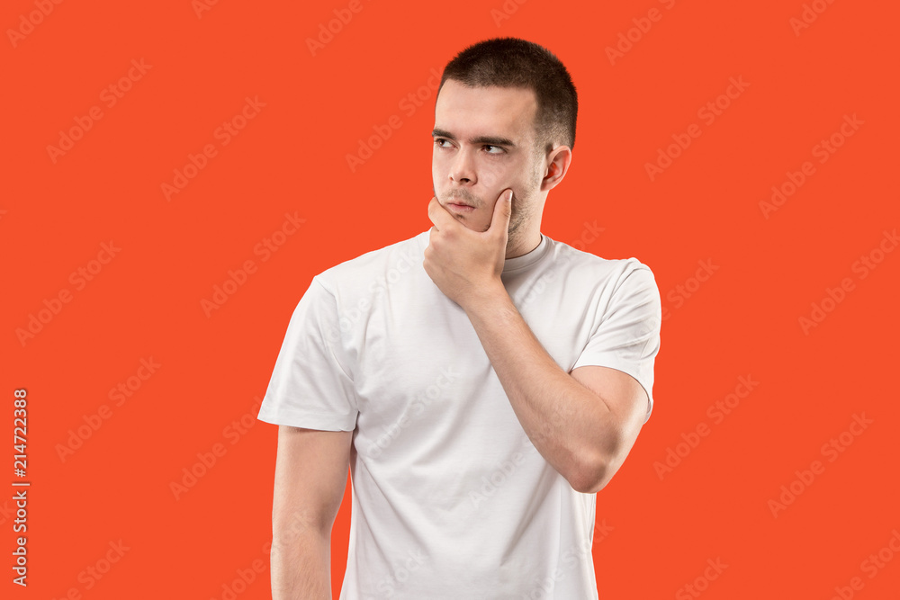 Suspiciont. Doubtful pensive man with thoughtful expression making choice Suspiciont. Doubtful pensive man with thoughtful expression making choice