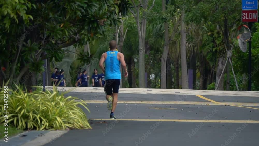 Young man jogging in park, super slow motion 240fps
Young man jogging in park, super slow motion 240fps