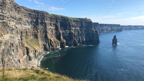 The famous Cliffs of Moher are sea cliffs located at the southwestern edge of the Burren region in County Clare, Ireland. They run for about 14 kilometres. photo