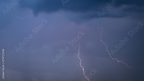 The discharge of lightning in the sky as a background