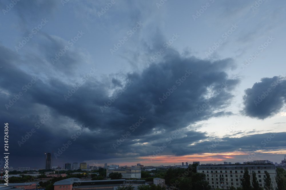 Moscow, Russia. Dramatic clouds over the city at sunset. Houses against the beautiful sky