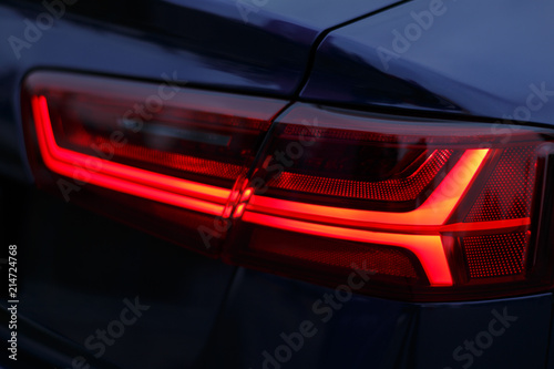 The red light of the taillights of the car Audi
