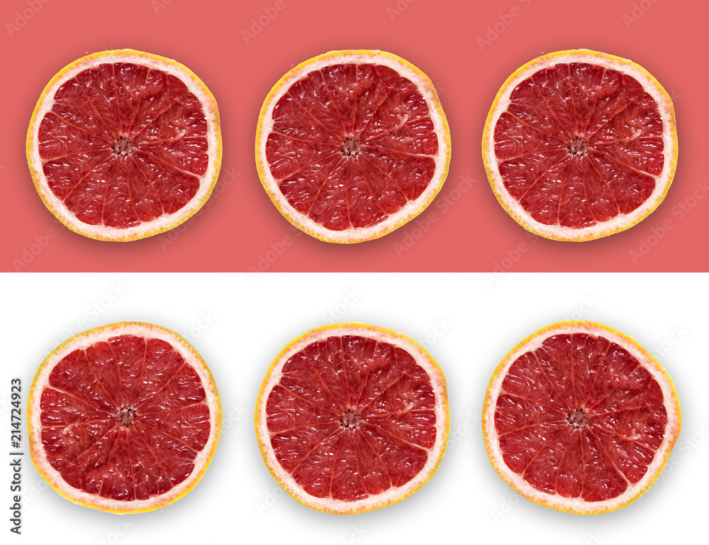 Grapefruit Slices On The Pink and White Background Grapefruit Slices On The Pink and White Background
